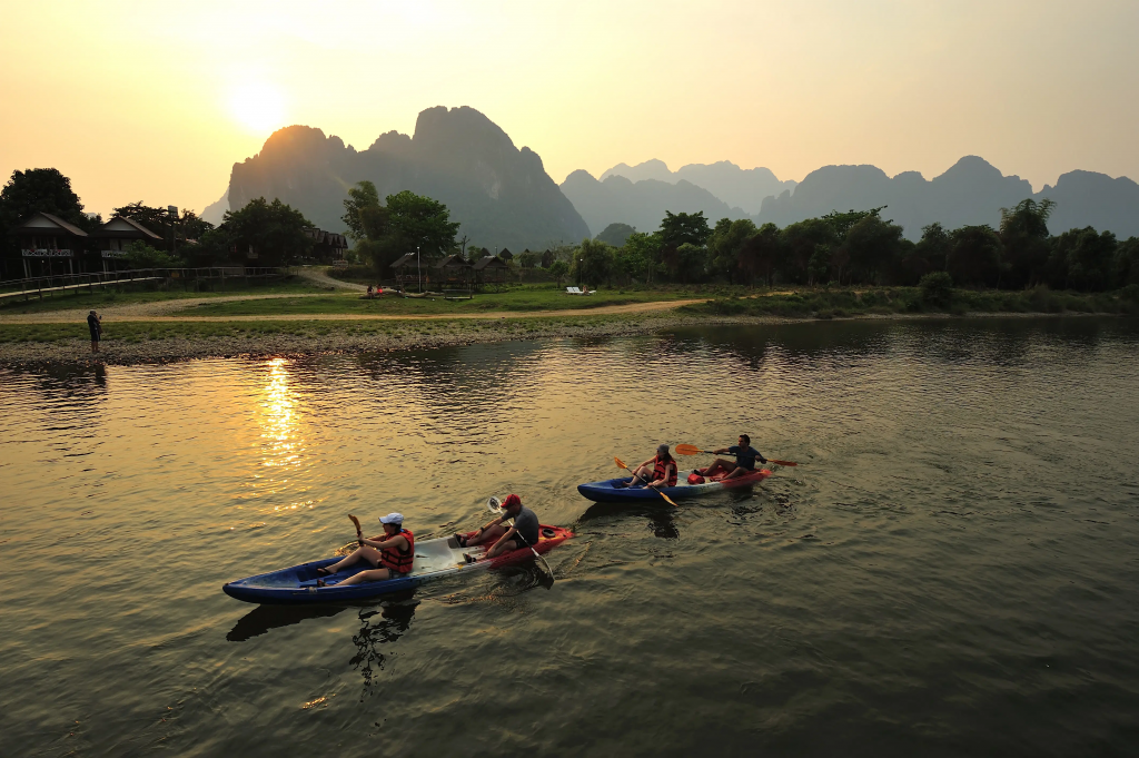 Rowers in a river in laos